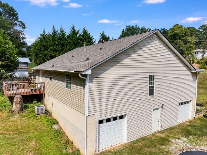 43 Mimosa Street Buchanan, GA 30113 - Photo 22 of 33 a view of a white house next to a yard with wooden fence