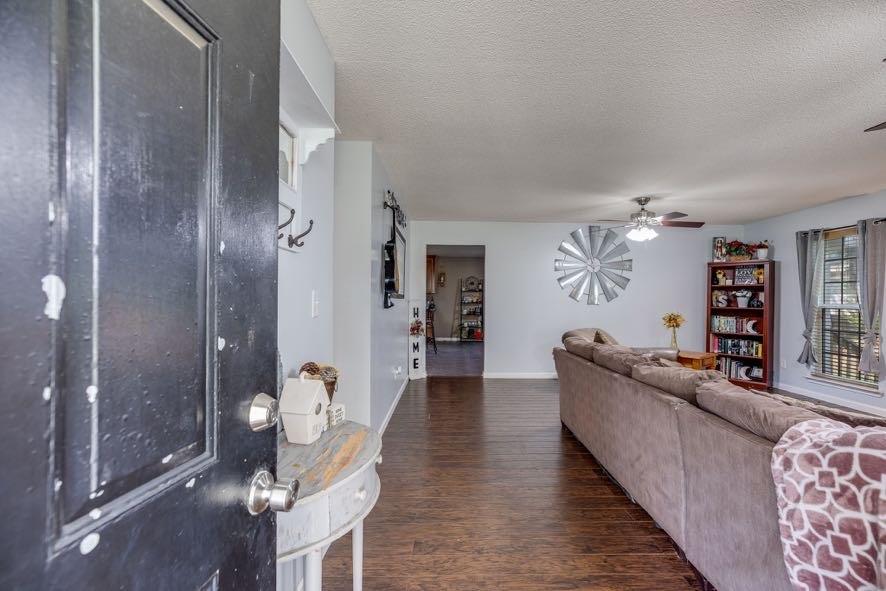 43 Mimosa Street Buchanan, GA 30113 - Photo 7 of 33 a living room with furniture and a wooden floor