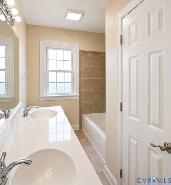 16487 Mountain Road Montpelier, VA 23192 - Photo 9 of 16 a bath tub sitting next to a white sink