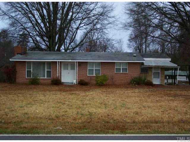 829 Pine Ridge Road Zebulon, NC 27597 - Photo 1 of 1 front view of a house with a yard