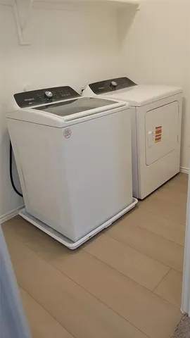 a utility room with dryer and washer