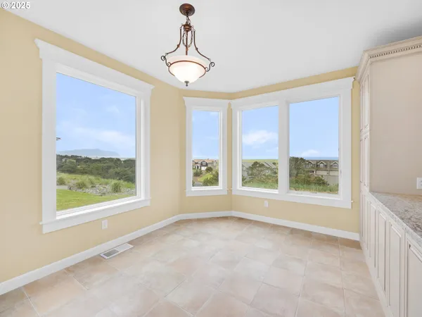 a view of an empty room with windows