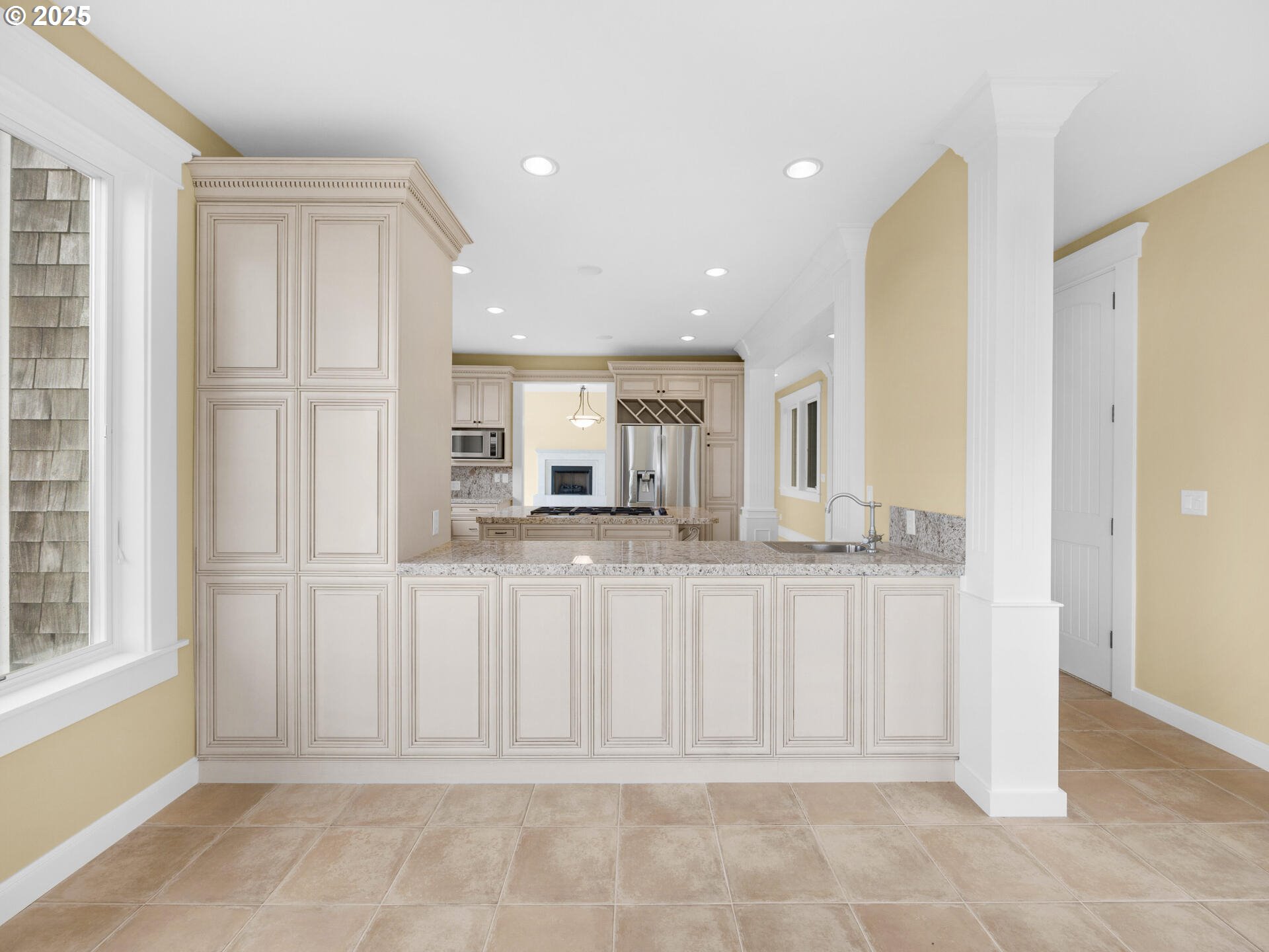 88902 Pinehurst Road Gearhart, OR 97138 - Photo 14 of 48 a view of a kitchen with white cabinets
