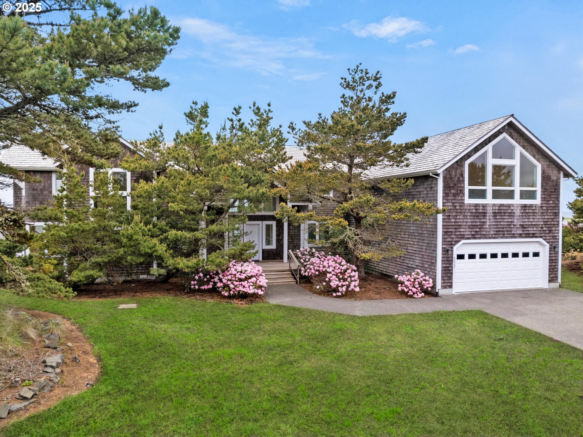 88902 Pinehurst Road Gearhart, OR 97138 - Photo 2 of 48 a view of a house with a yard