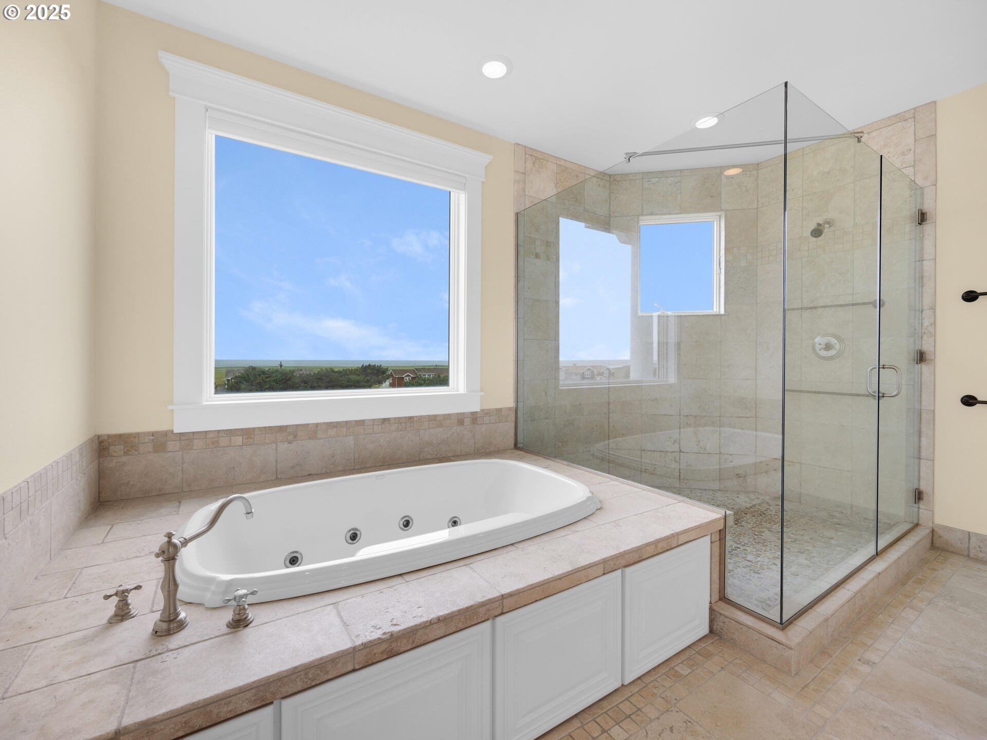 88902 Pinehurst Road Gearhart, OR 97138 - Photo 21 of 48 a bathroom with a bathtub and a shower