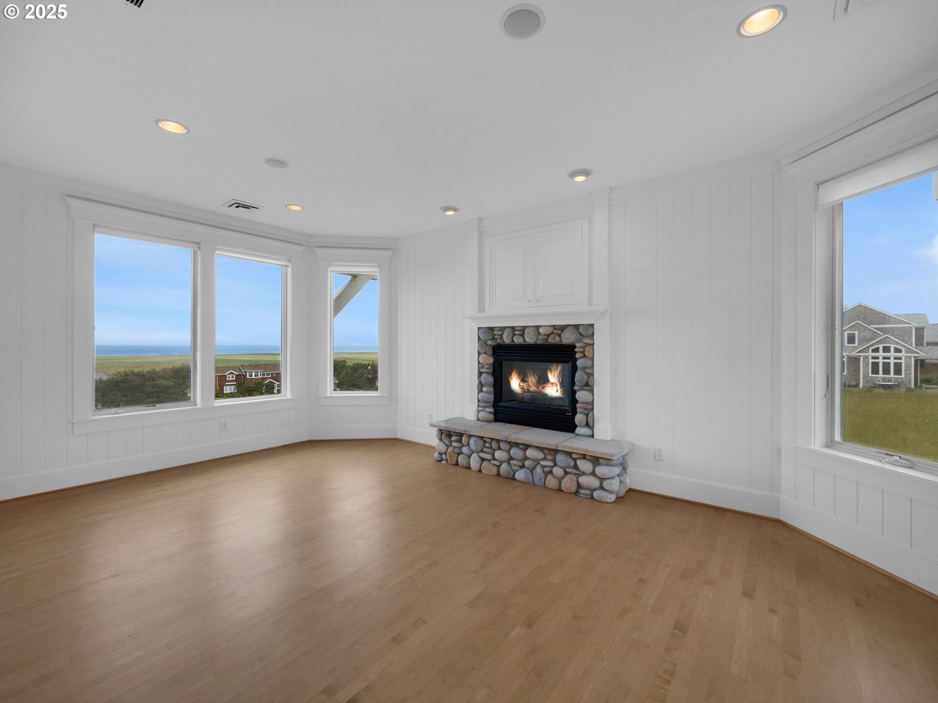 88902 Pinehurst Road Gearhart, OR 97138 - Photo 24 of 48 a view of an empty room with a fireplace and a window