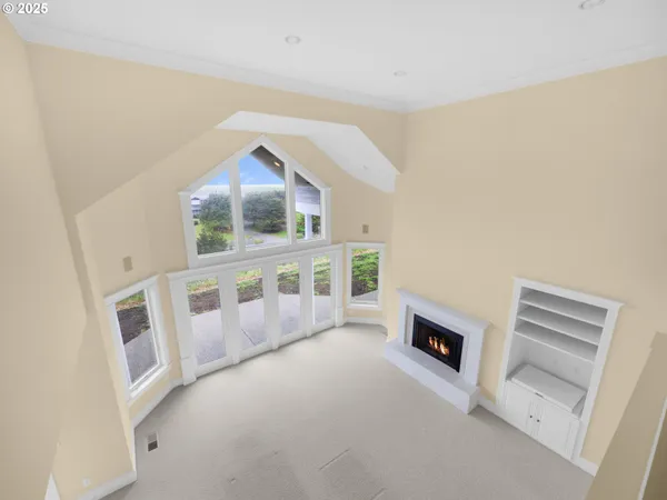 wooden floor in an empty room with a fireplace
