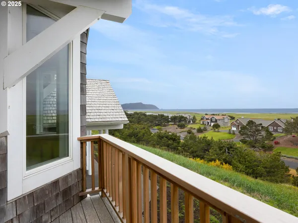 a view of a balcony with an ocean view