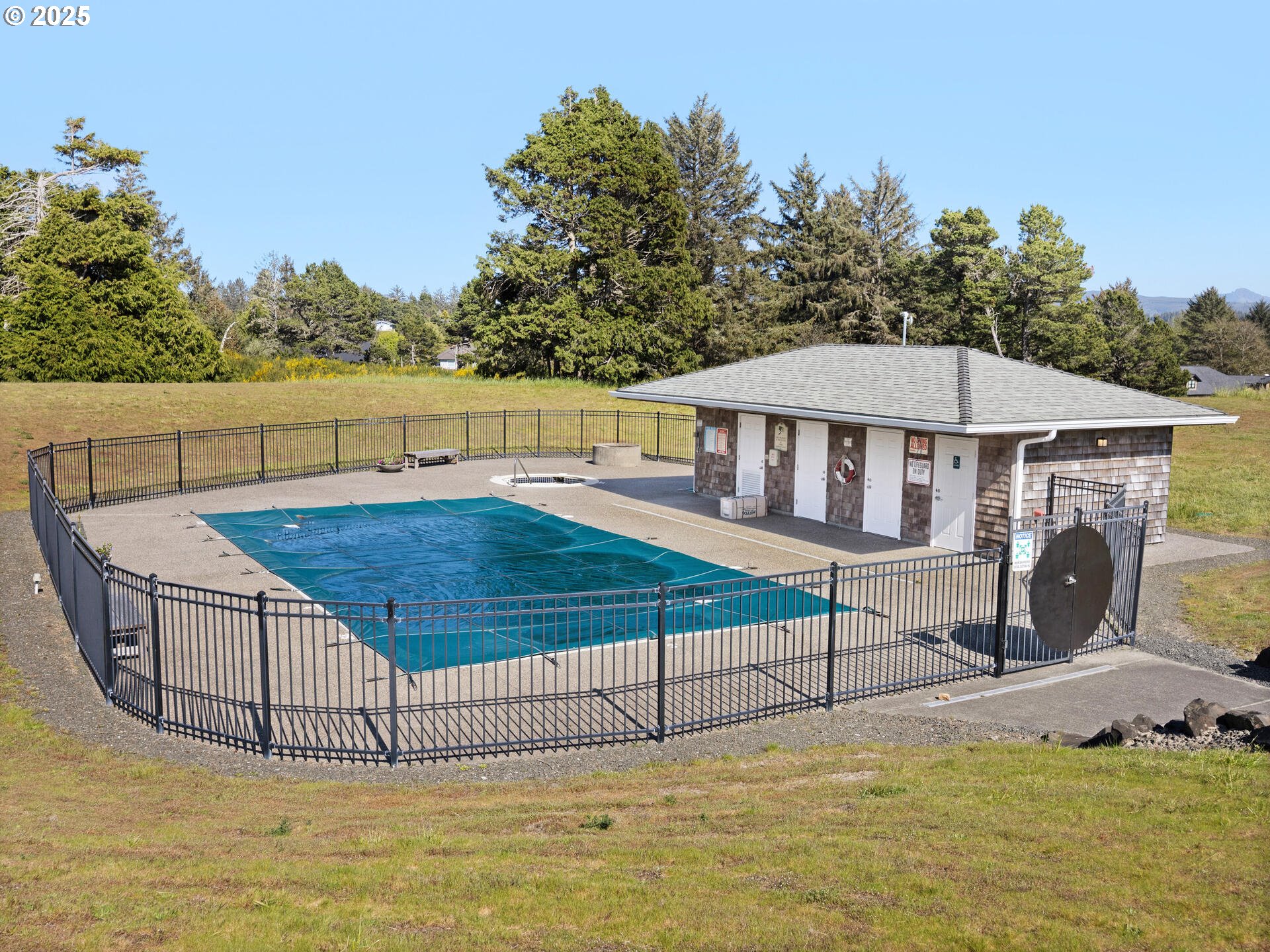 88902 Pinehurst Road Gearhart, OR 97138 - Photo 47 of 48 a view of a house with a swimming pool and sitting area