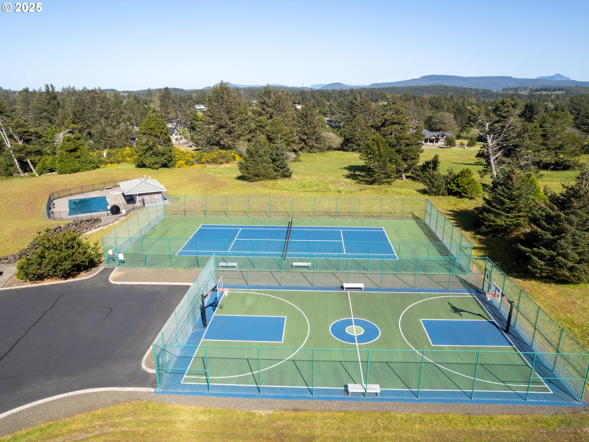 88902 Pinehurst Road Gearhart, OR 97138 - Photo 48 of 48 a view of a swimming pool with an ocean view