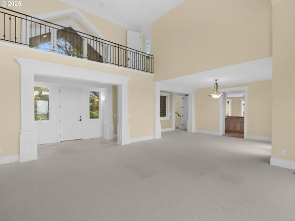 a view of a big room with closet and windows