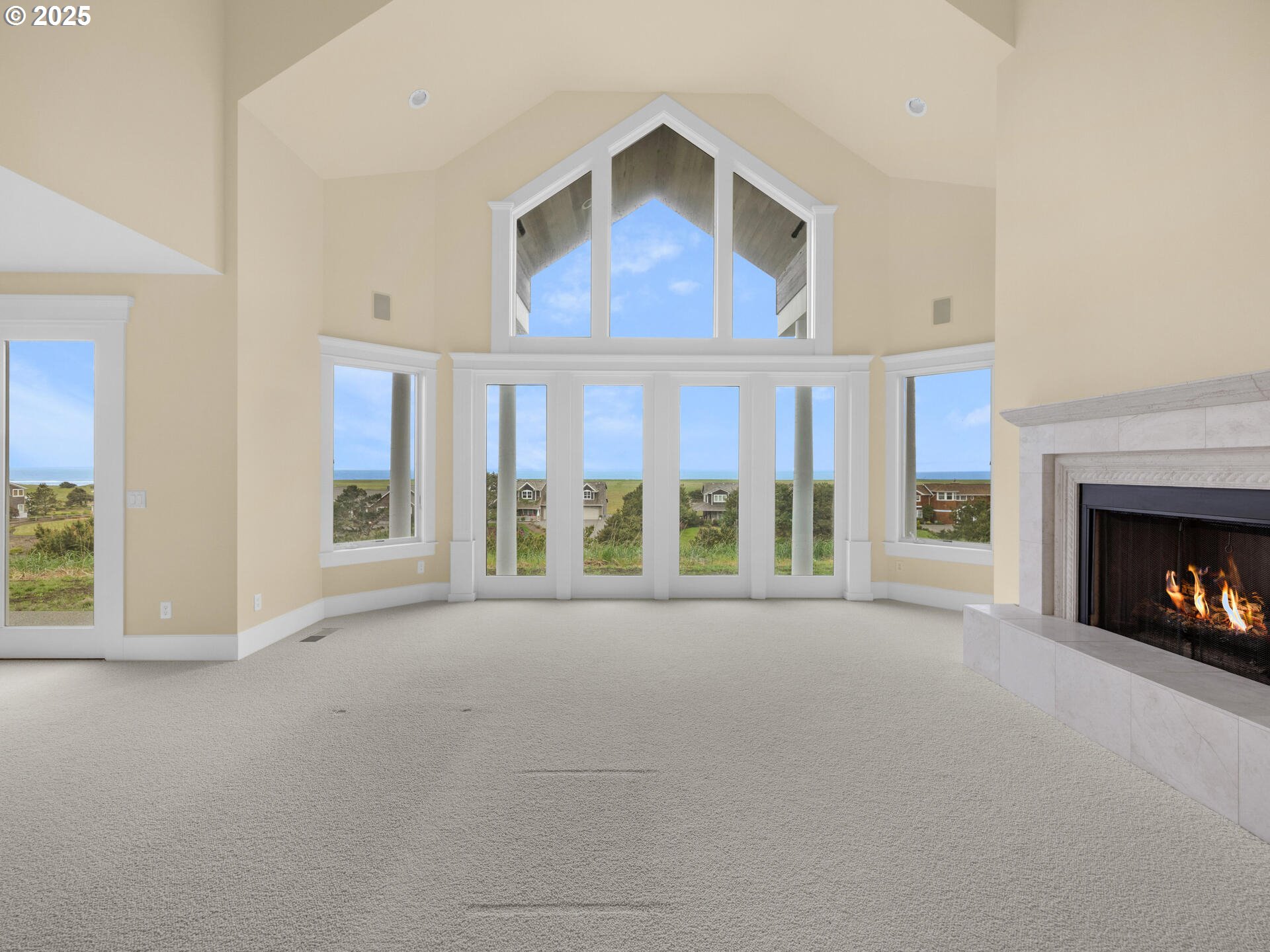 88902 Pinehurst Road Gearhart, OR 97138 - Photo 8 of 48 a view of an empty room with a fireplace and a window