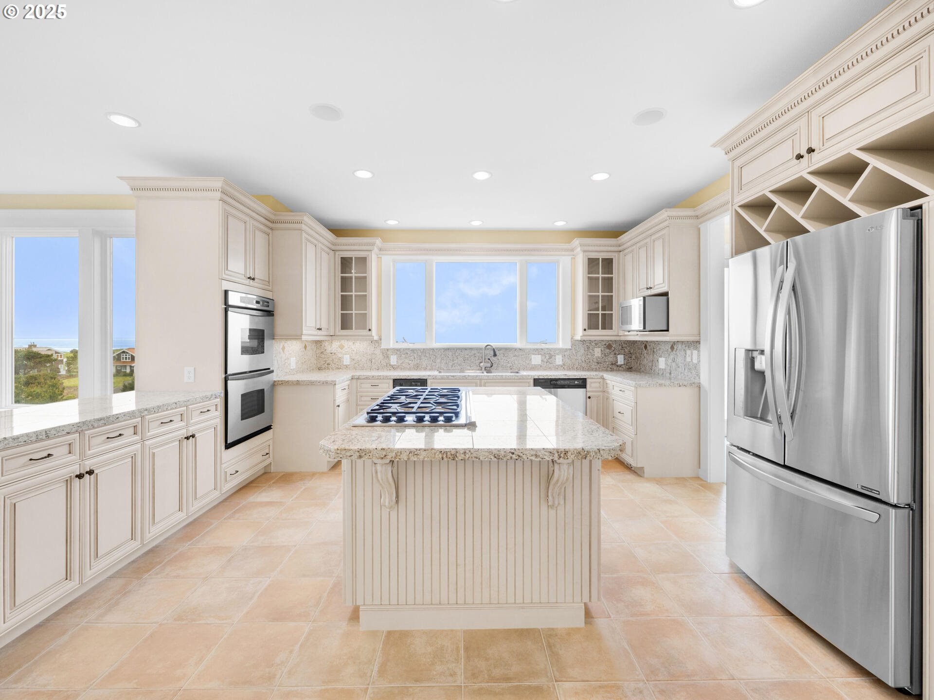88902 Pinehurst Road Gearhart, OR 97138 - Photo 9 of 48 a kitchen with granite countertop a refrigerator and a sink