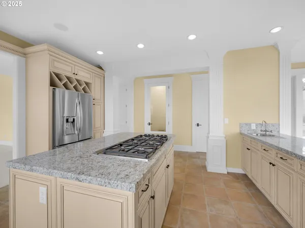 a kitchen with a sink stove and refrigerator