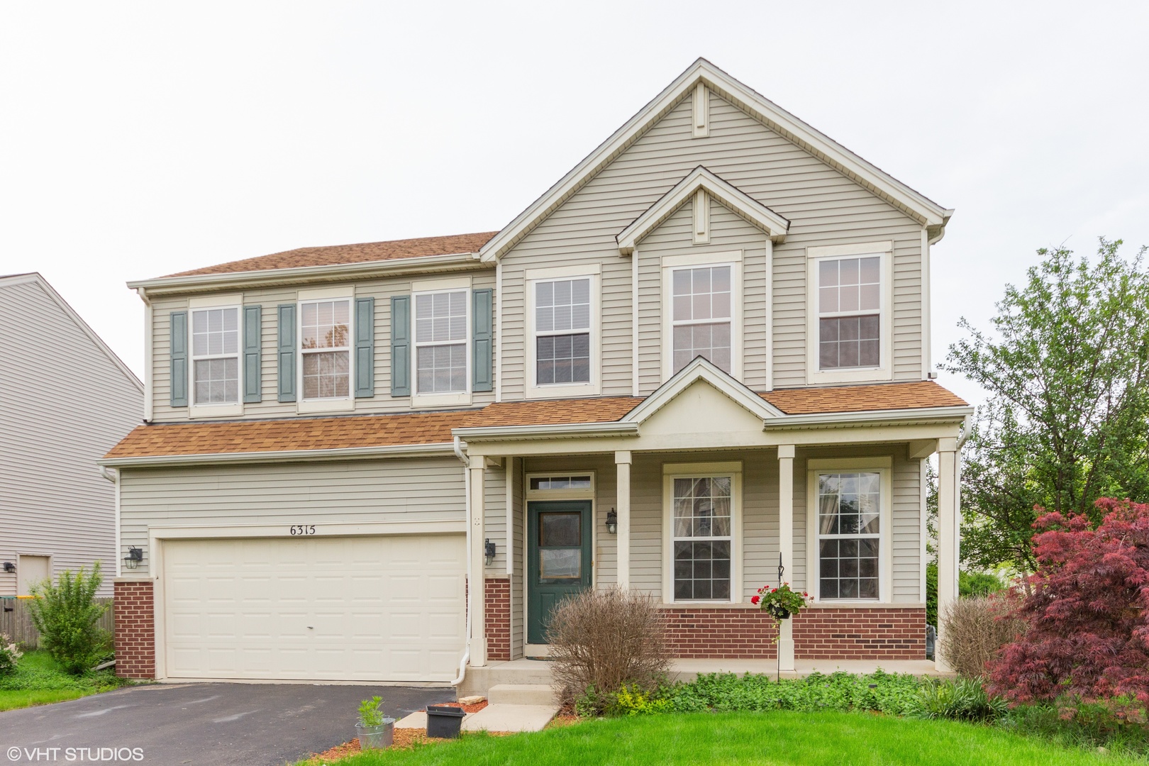 6315 Colton Ridge Court Plainfield, IL 60586 - Photo 1 of 15 a front view of a house with a yard and garage
