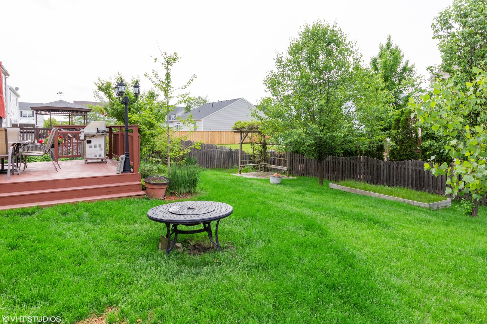 6315 Colton Ridge Court Plainfield, IL 60586 - Photo 14 of 15 a view of a backyard with a table and chairs