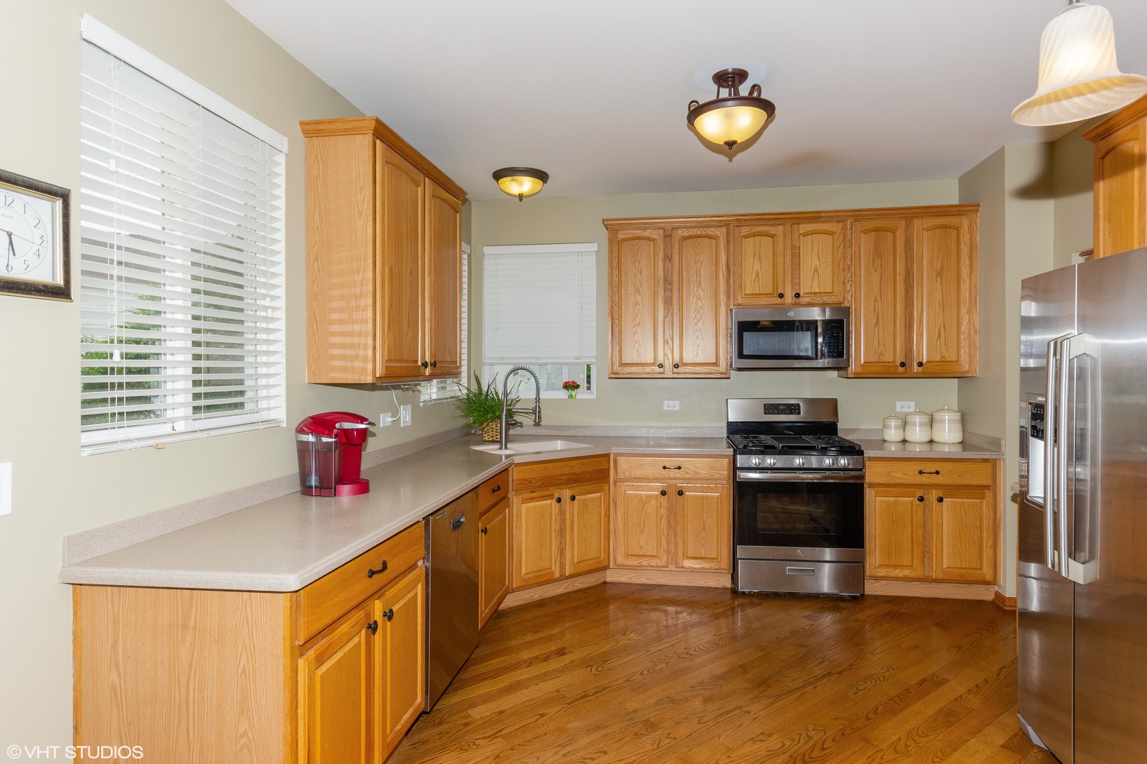 6315 Colton Ridge Court Plainfield, IL 60586 - Photo 3 of 15 a kitchen with stainless steel appliances a stove cabinets and a sink