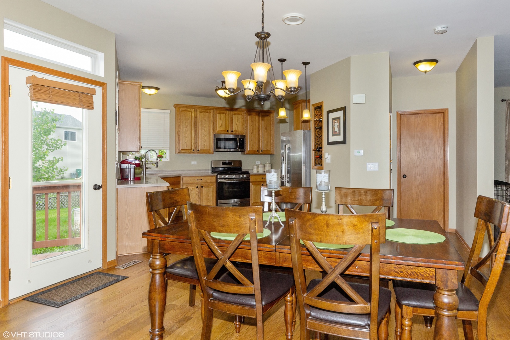 6315 Colton Ridge Court Plainfield, IL 60586 - Photo 4 of 15 a view of a dining room with furniture and a chandelier