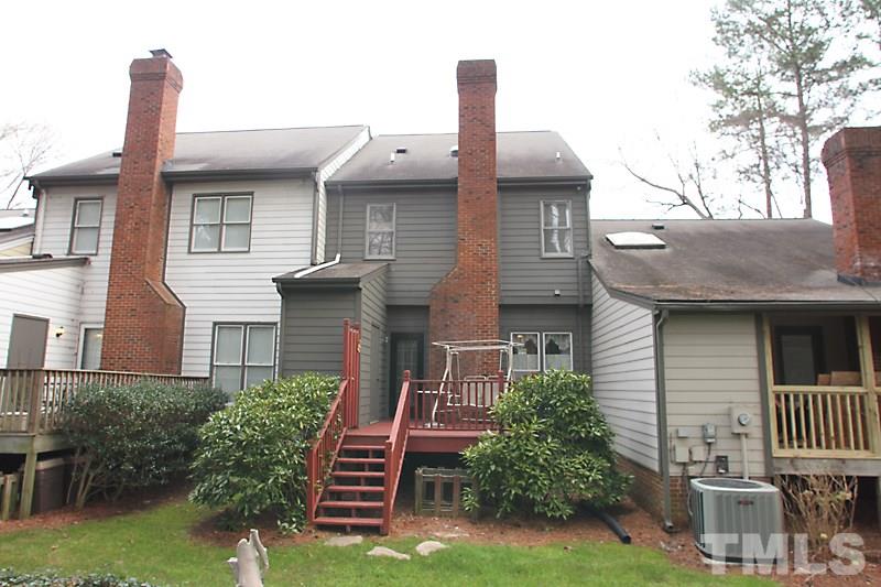 8314 Wycombe Lane Raleigh, NC 27615 - Photo 12 of 13 Exterior back with private deck and storage shed