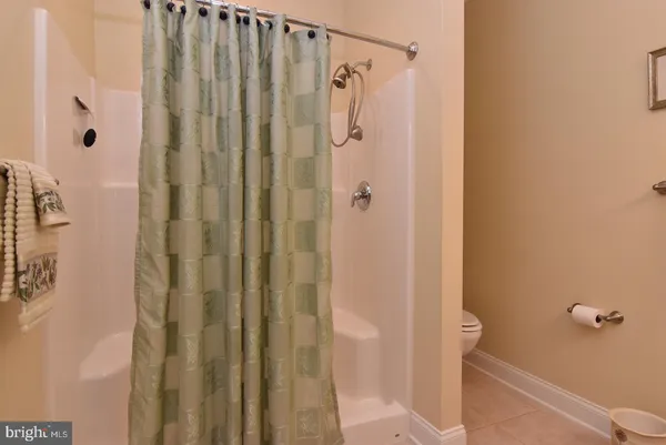 a bathroom with a shower and a sink