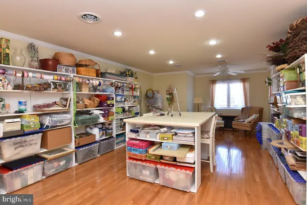 a living room with lots of furniture and a book shelf
