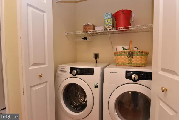 a view of a balcony with chair and the potted plants