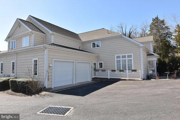 a view of a chairs and table in the patio