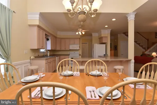 a kitchen with a table chairs and a stove