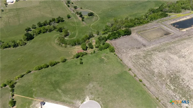 a view of a swimming pool with a yard