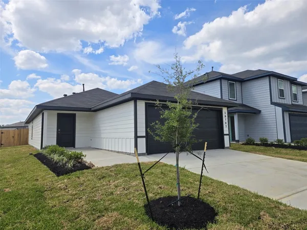 a house view with a garden space