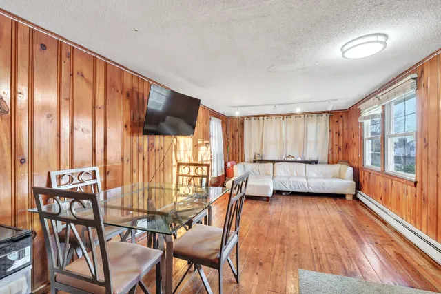 a view of kitchen with furniture and wooden floor