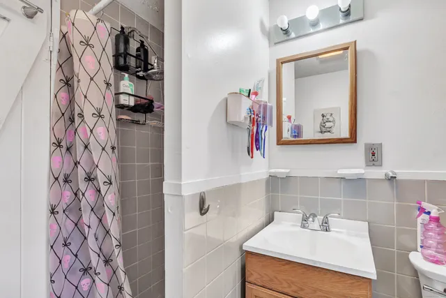 a bed room with a bed and a mirror