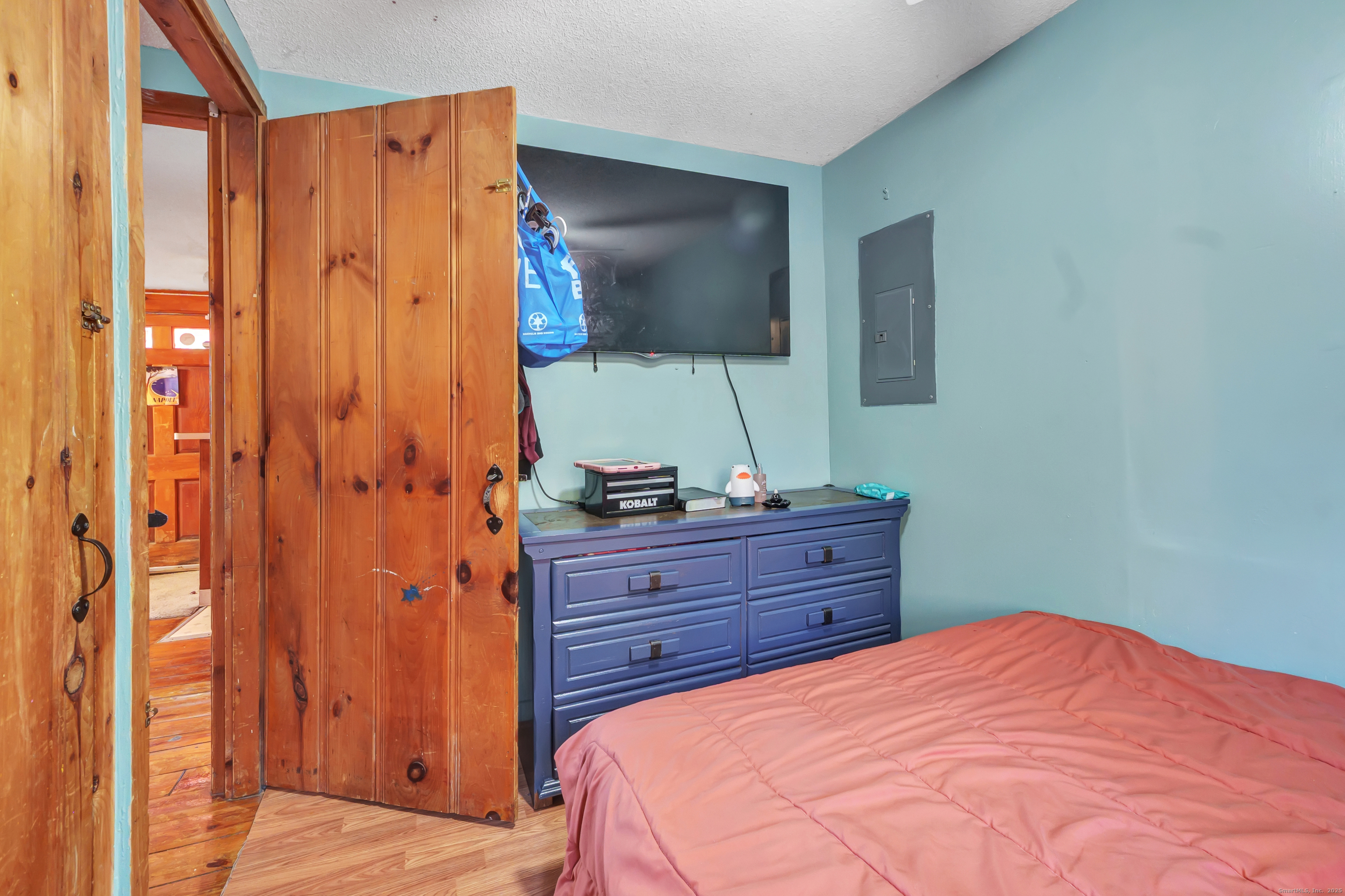 12 Hale Road East Hampton, CT 06424 - Photo 22 of 27 a bed room with a bed and a mirror