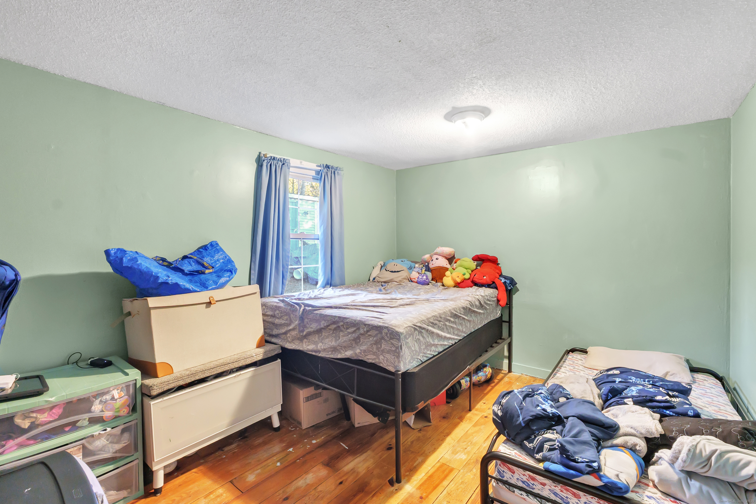 12 Hale Road East Hampton, CT 06424 - Photo 23 of 27 a room with a bed and a table