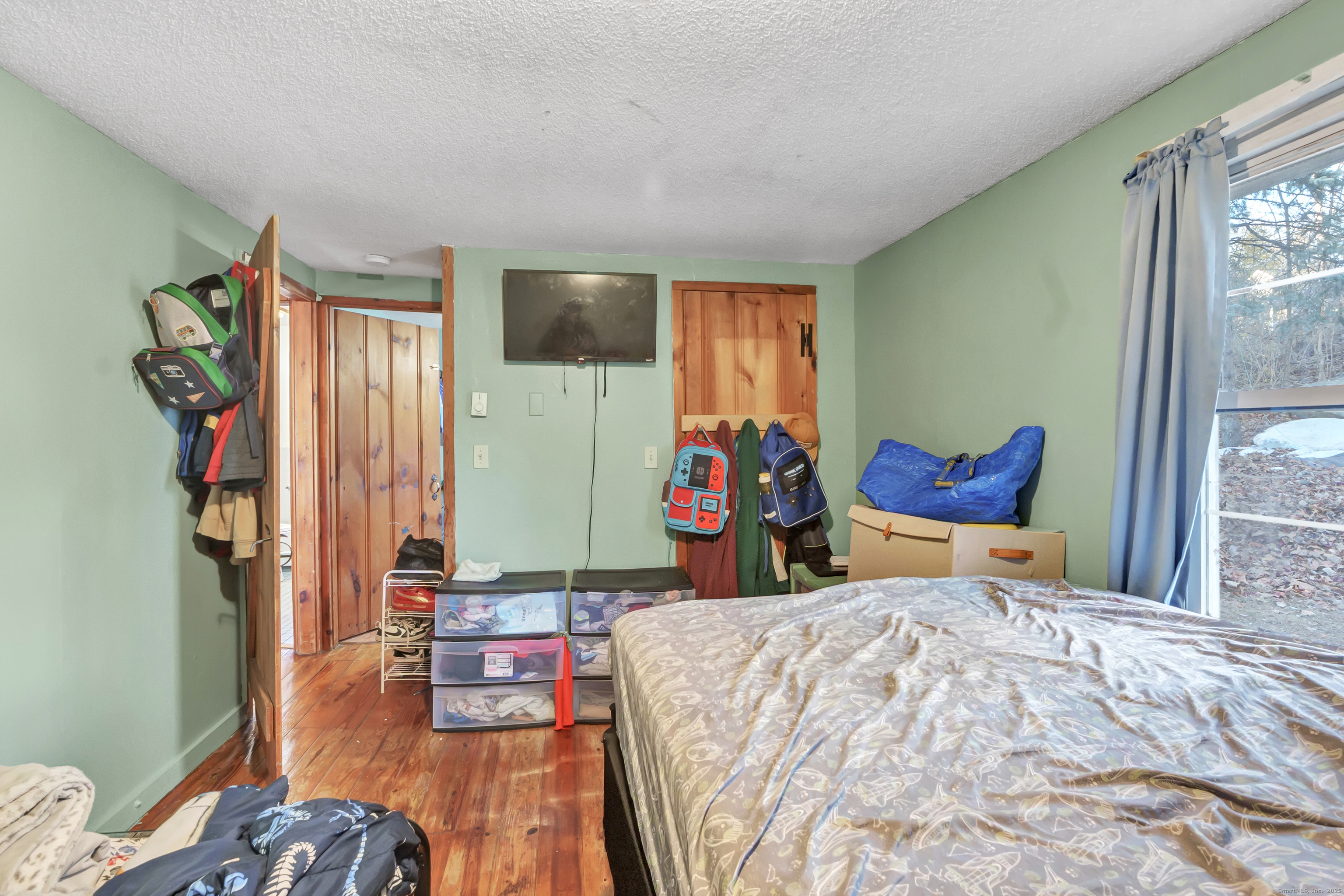 12 Hale Road East Hampton, CT 06424 - Photo 24 of 27 a bed room with a bed mirror and a window