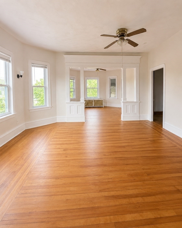 37 Shawmut Street Fall River, MA 02720 - Photo 3 of 16 a view of an empty room with window and wooden floor