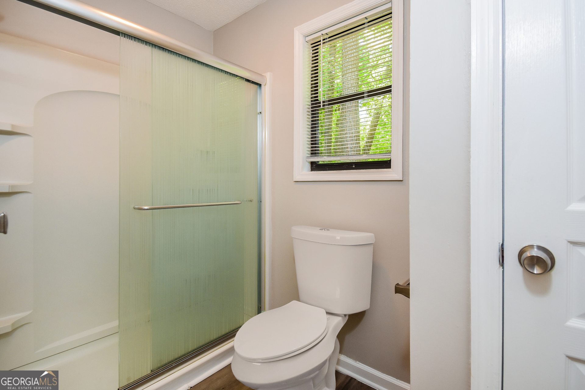 3970 Cripple Creek Drive Kennesaw, GA 30144 - Photo 14 of 17 a white toilet sitting next to a bathroom sink