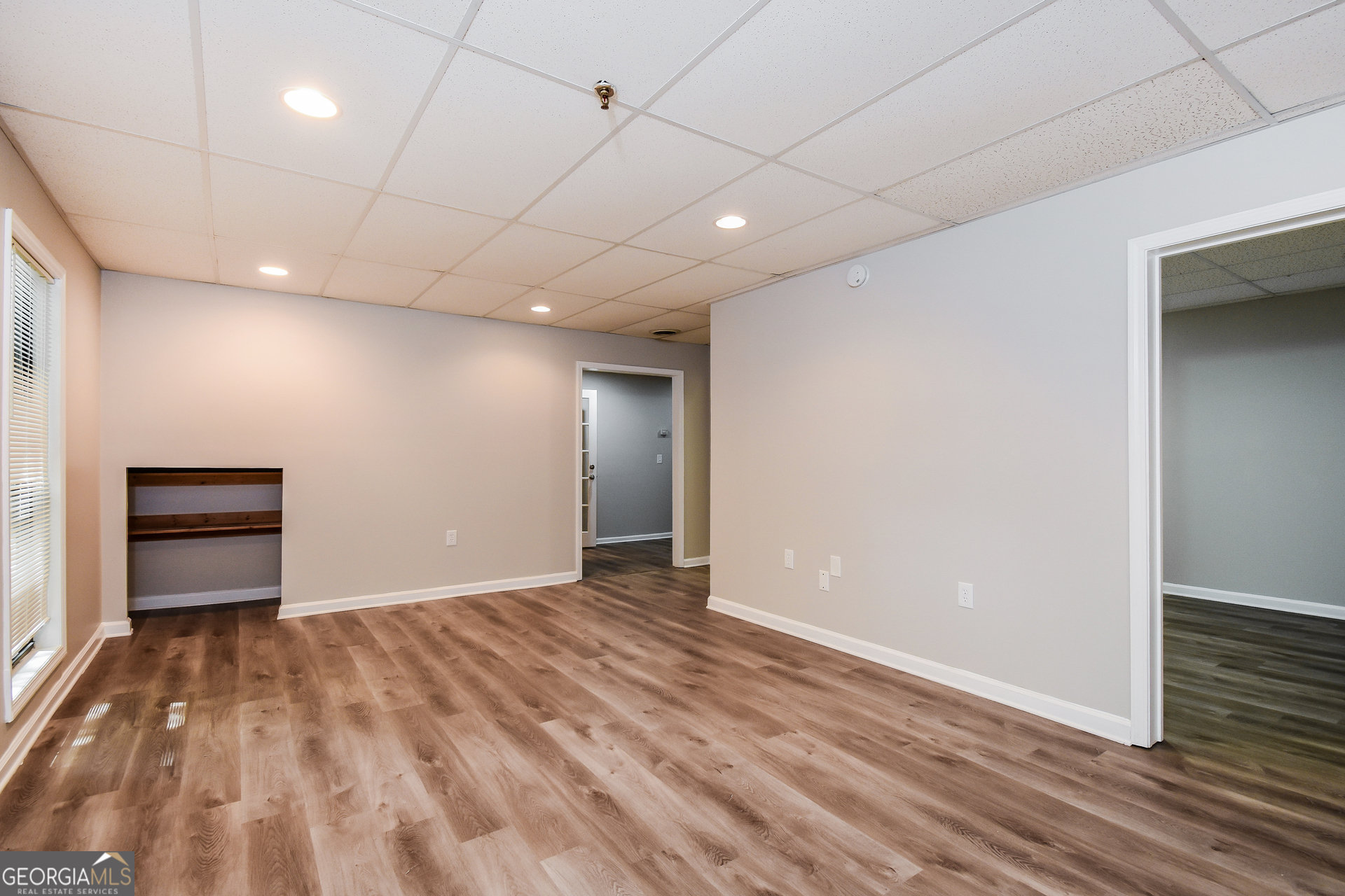 3970 Cripple Creek Drive Kennesaw, GA 30144 - Photo 15 of 17 an empty room with wooden floor closet and windows
