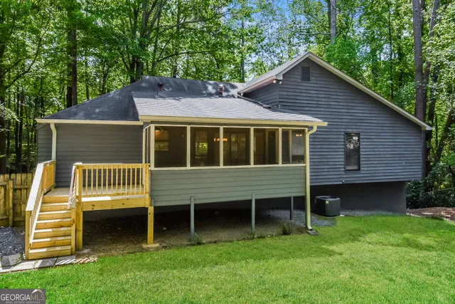 a view of a backyard with a small cabin