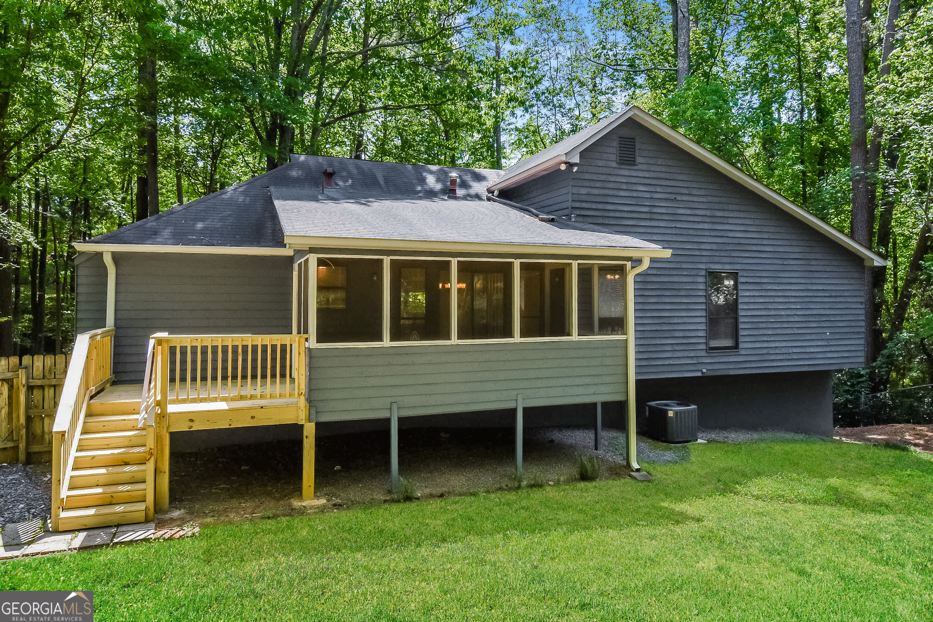 3970 Cripple Creek Drive Kennesaw, GA 30144 - Photo 16 of 17 a front view of a house with a garden