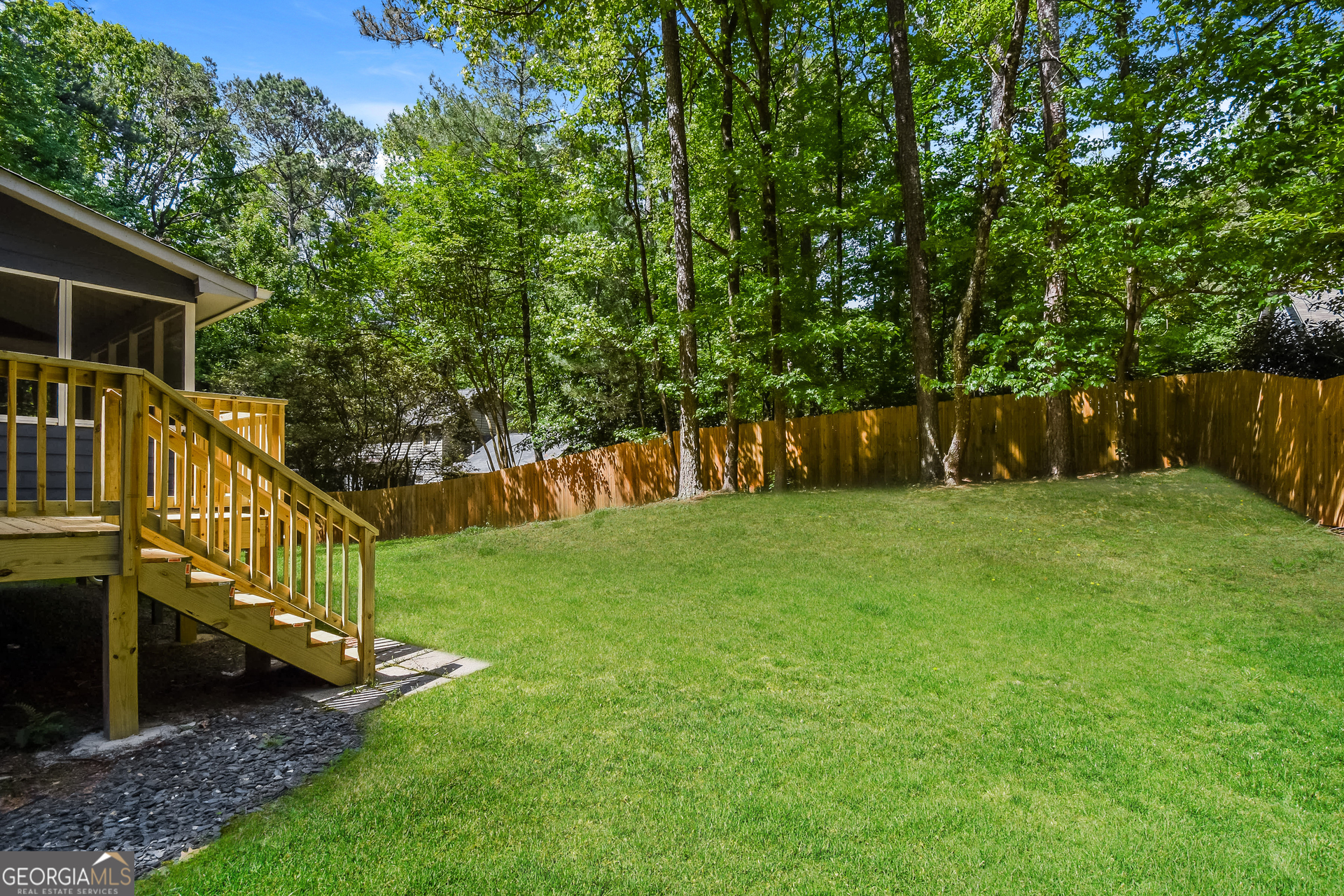 3970 Cripple Creek Drive Kennesaw, GA 30144 - Photo 17 of 17 a view of a backyard with a small cabin
