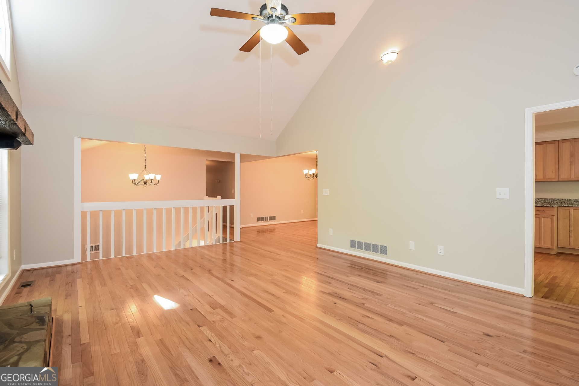 3970 Cripple Creek Drive Kennesaw, GA 30144 - Photo 5 of 17 a view of a livingroom with wooden floor and a ceiling fan
