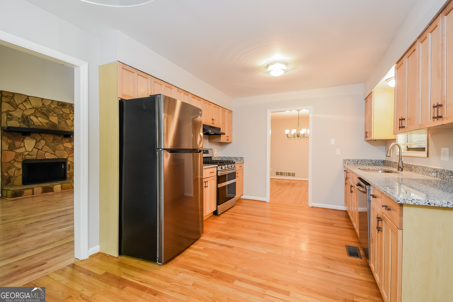 3970 Cripple Creek Drive Kennesaw, GA 30144 - Photo 8 of 17 a kitchen with stainless steel appliances granite countertop a refrigerator and a stove top oven