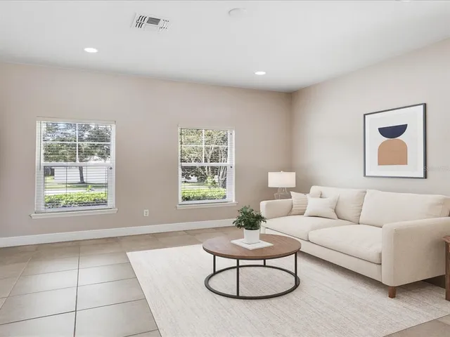 a living room with furniture and a window