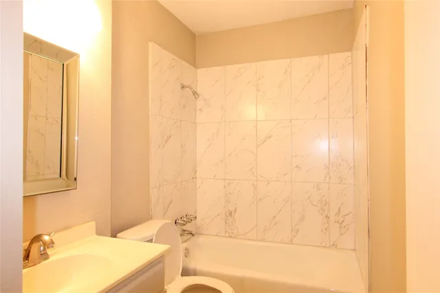 a bathroom with a bathtub and a sink