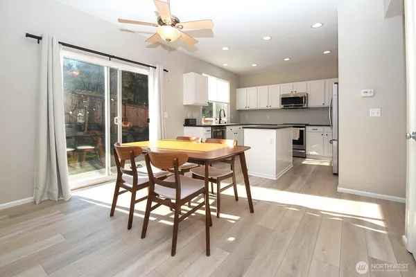 a kitchen with a table and chairs in it