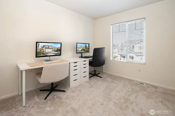 a workspace with furniture and a window