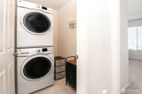 a view of a hallway with washer and dryer