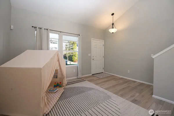 a view of livingroom with hardwood floor and a ceiling fan