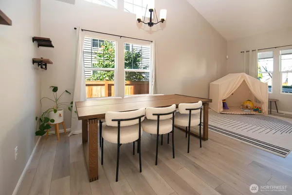 a dining room with furniture and window